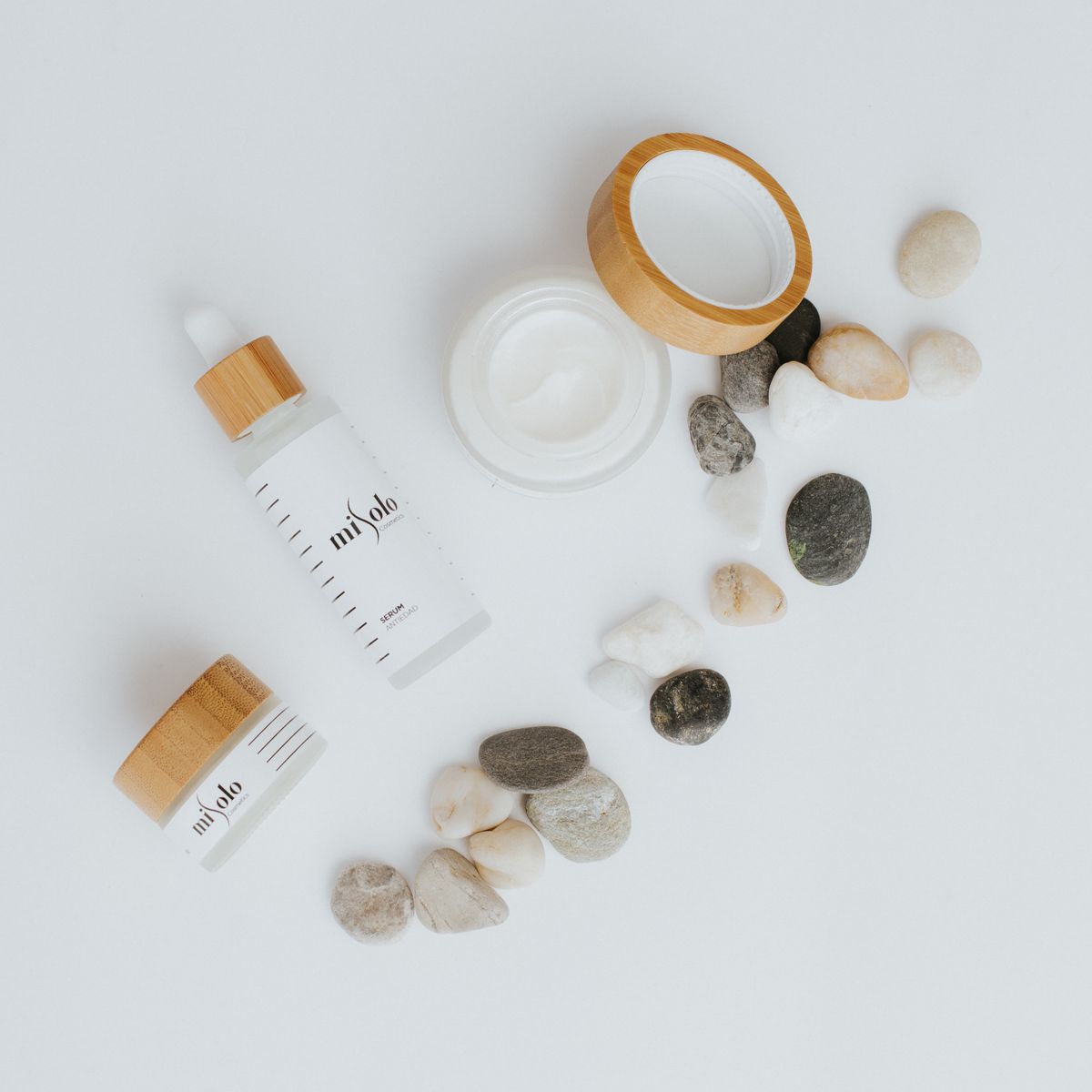 Clean spa skincare products with stones and bamboo